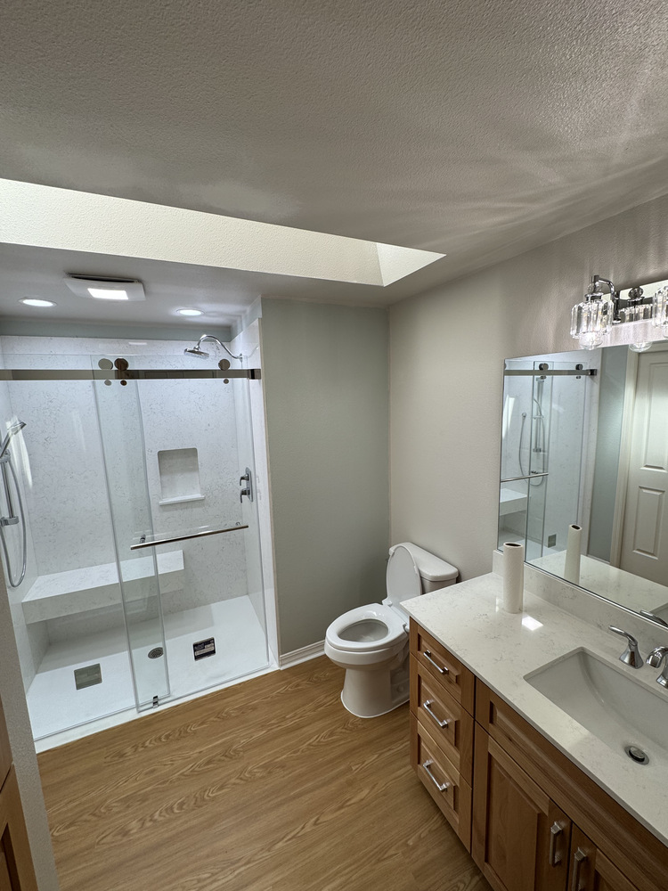 Full bathroom remodel with glass shower enclosure and quartz vanity in Salem, OR by Righteous Renovations