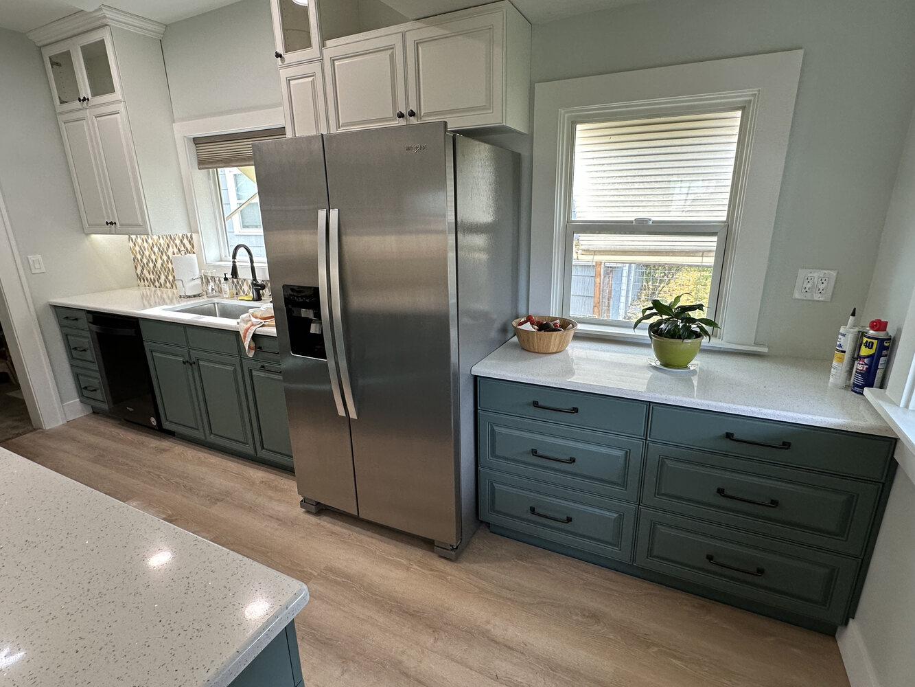 Refrigerator wall with extended cabinetry and drawer storage by Righteous Renovations in Salem, OR