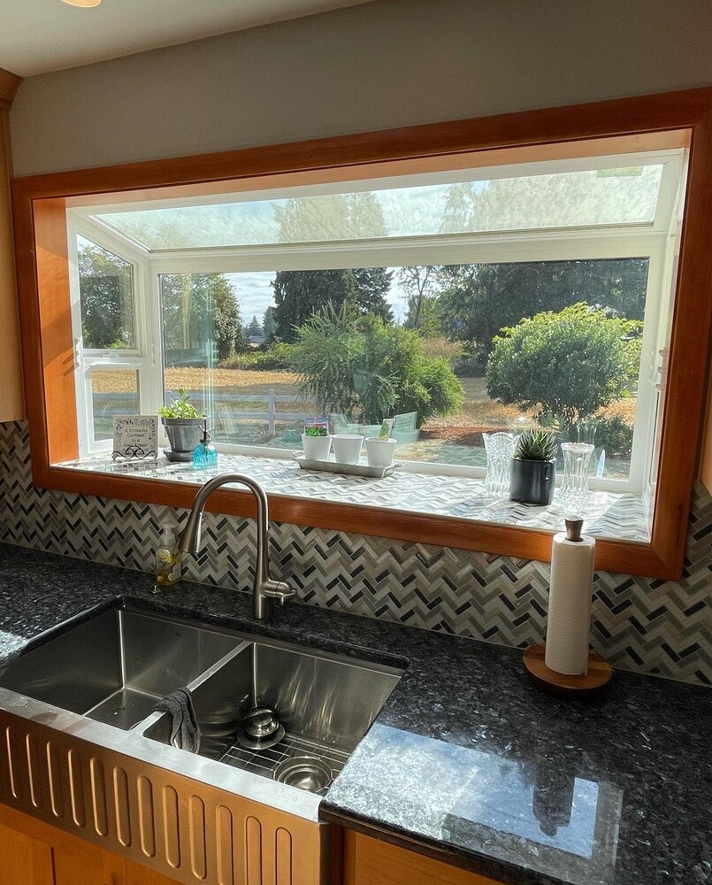 Window backsplash detail and dual sink installation by Righteous Renovations in a custom kitchen project in Silverton, OR
