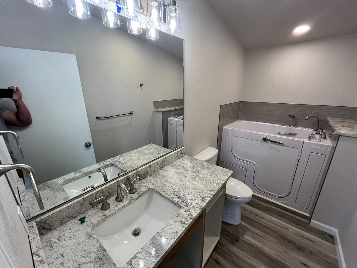 Accessible bathroom remodel with walk-in tub and granite countertop by Righteous Renovations in Salem, OR