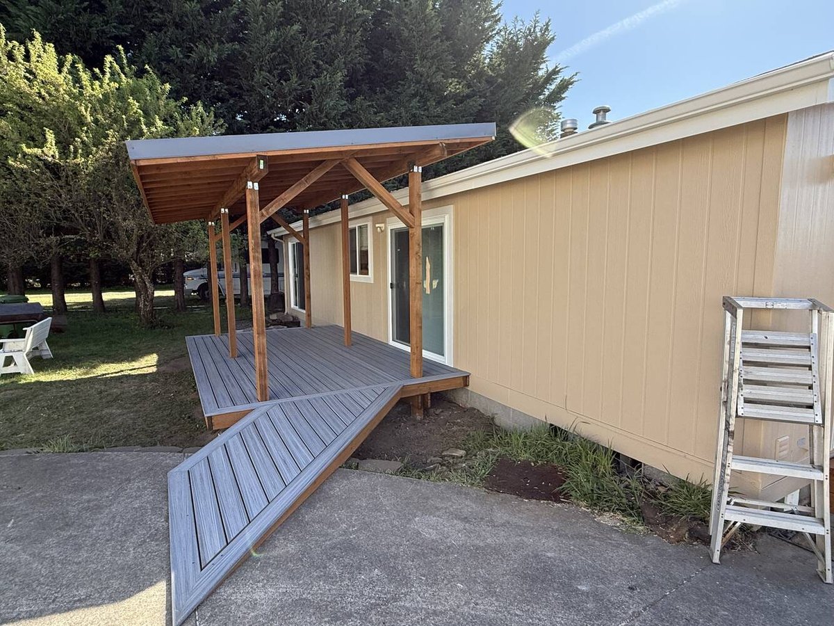 New composite deck and wood awning installed on a custom home in Salem, OR by Righteous Renovations