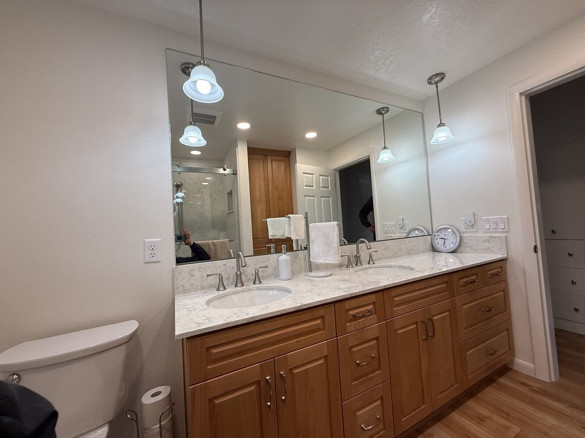 Wide-angle view of custom bathroom vanity with quartz counters by Righteous Renovations in Oregon City, OR