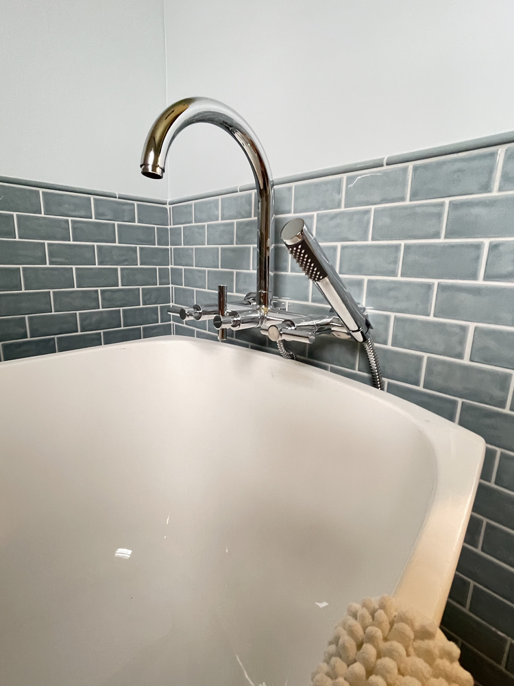 Close-up of luxury tub and modern faucet in a Salem, Oregon custom bathroom renovation by Righteous Renovations