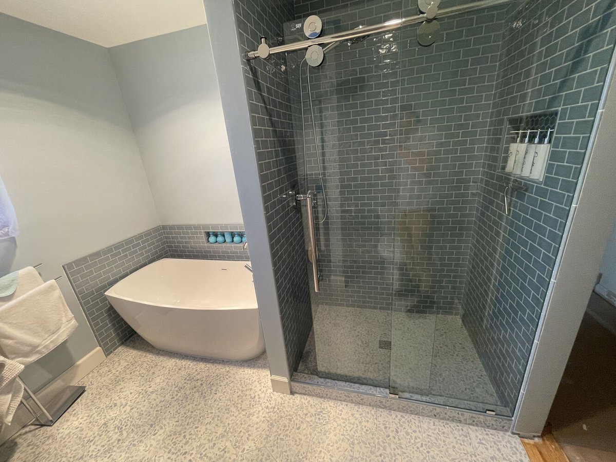 Full view of luxury bathroom featuring a soaking tub and glass-enclosed shower by Righteous Renovations in Salem, OR