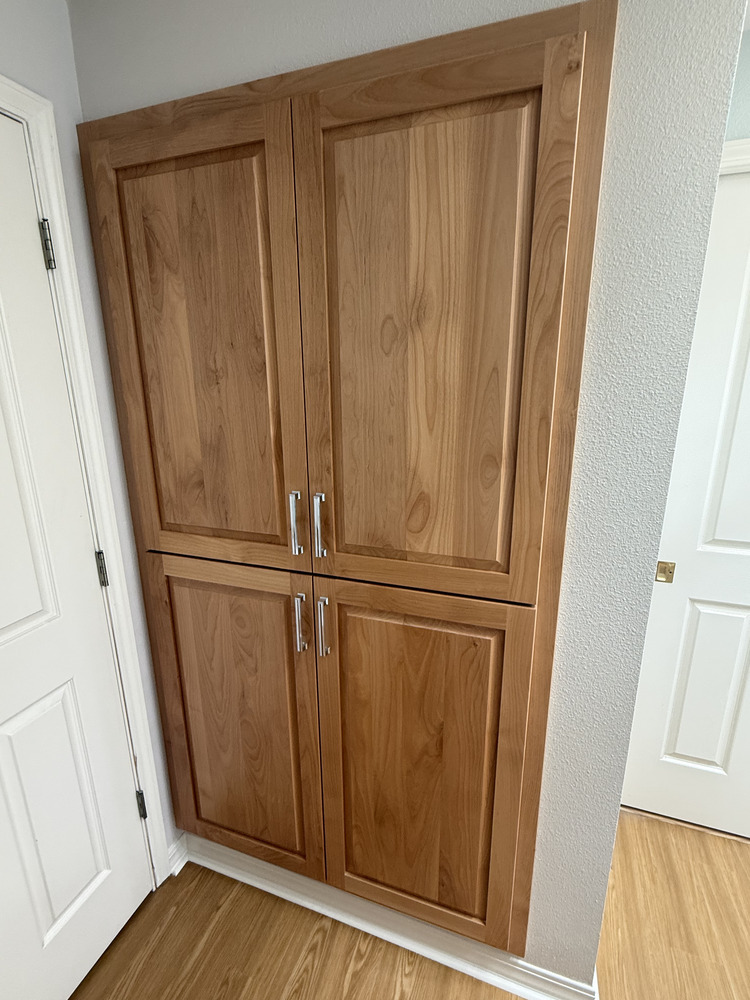 Custom built-in wood cabinet for bathroom storage by Righteous Renovations in a Salem, OR custom home