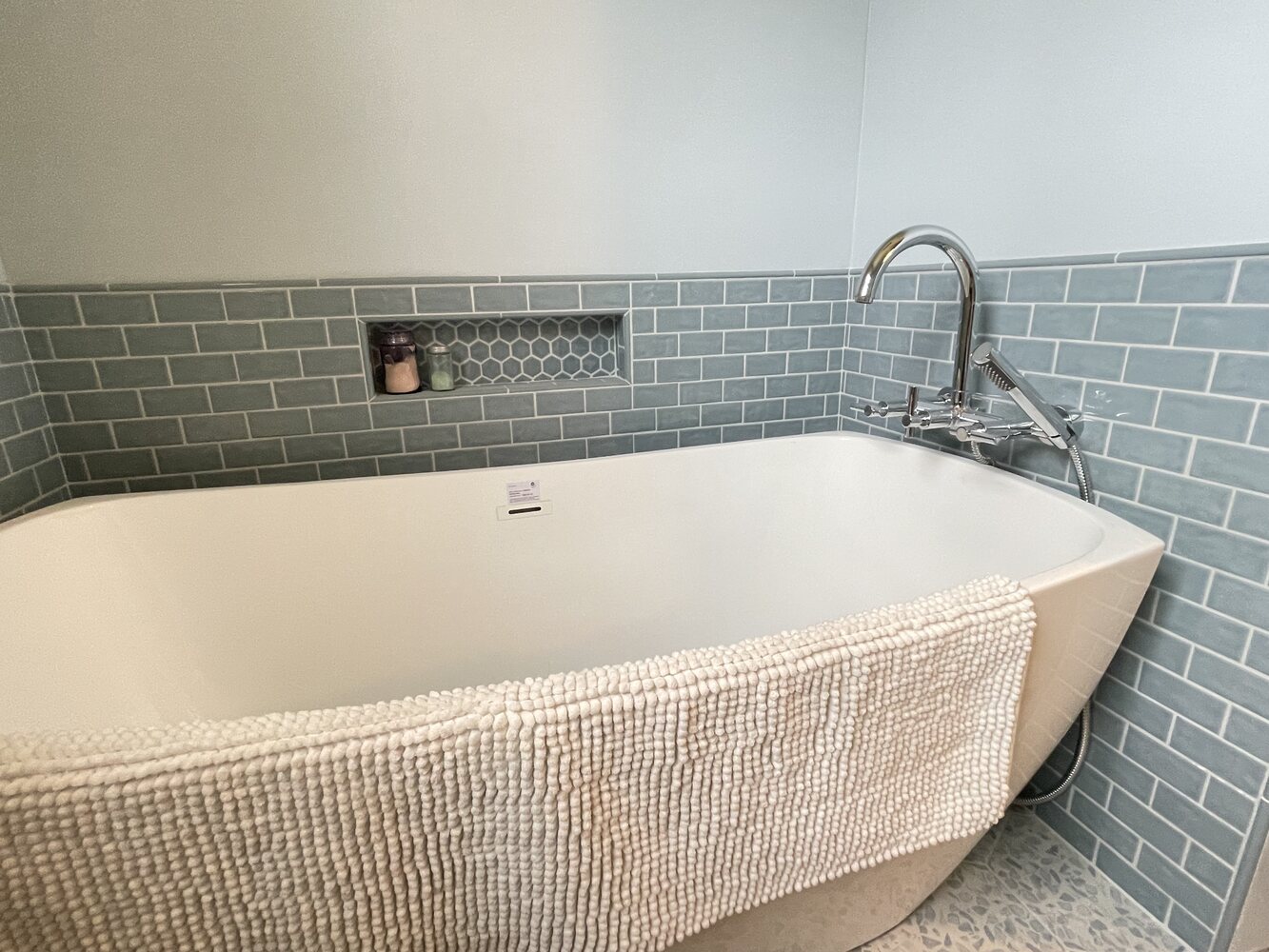 Custom bathroom remodel with accent wall tile and tub niche by Righteous Renovations in Salem, OR