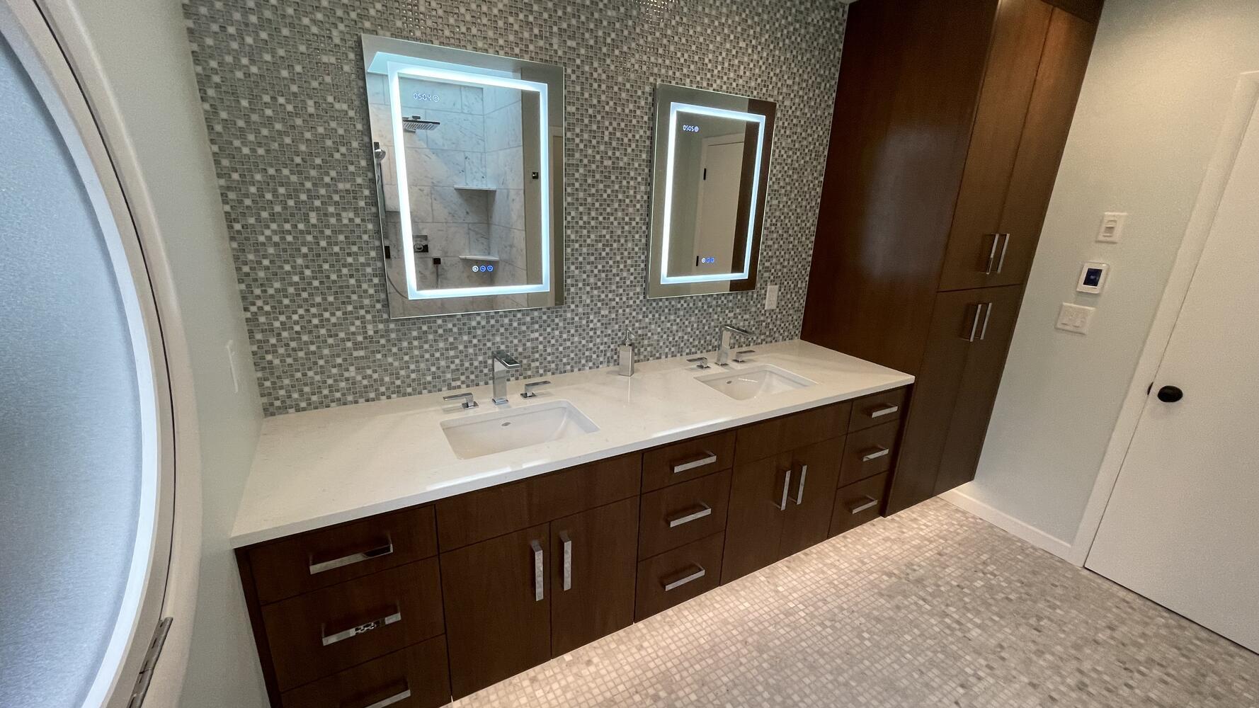 Modern double vanity with LED mirrors and mosaic backsplash by Righteous Renovations in Salem, OR