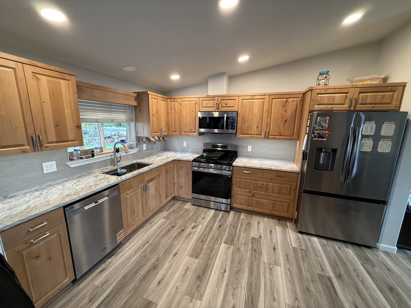 Custom kitchen remodel with wood cabinetry and stainless appliances by Righteous Renovations in Salem, OR