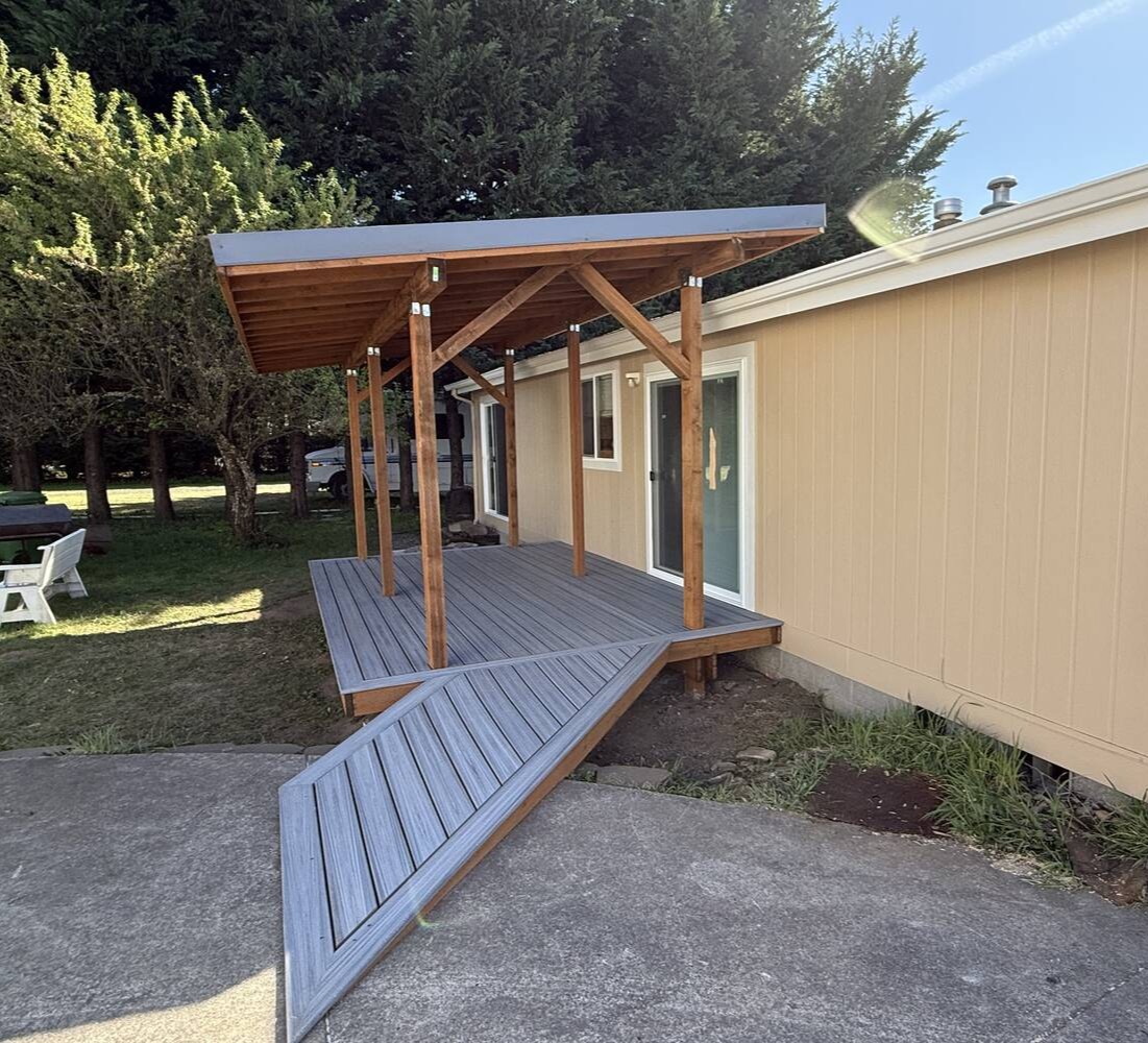 New composite deck and wood awning installed on a custom home in Salem, OR by Righteous Renovations