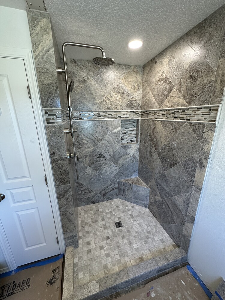 Gray tile walk-in shower remodel featuring mosaic accent by Righteous Renovations, serving Salem, OR