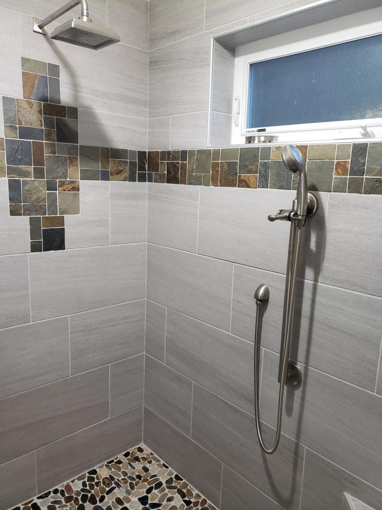 Righteous Renovations custom tiled shower featuring slate mosaic design in Salem, OR